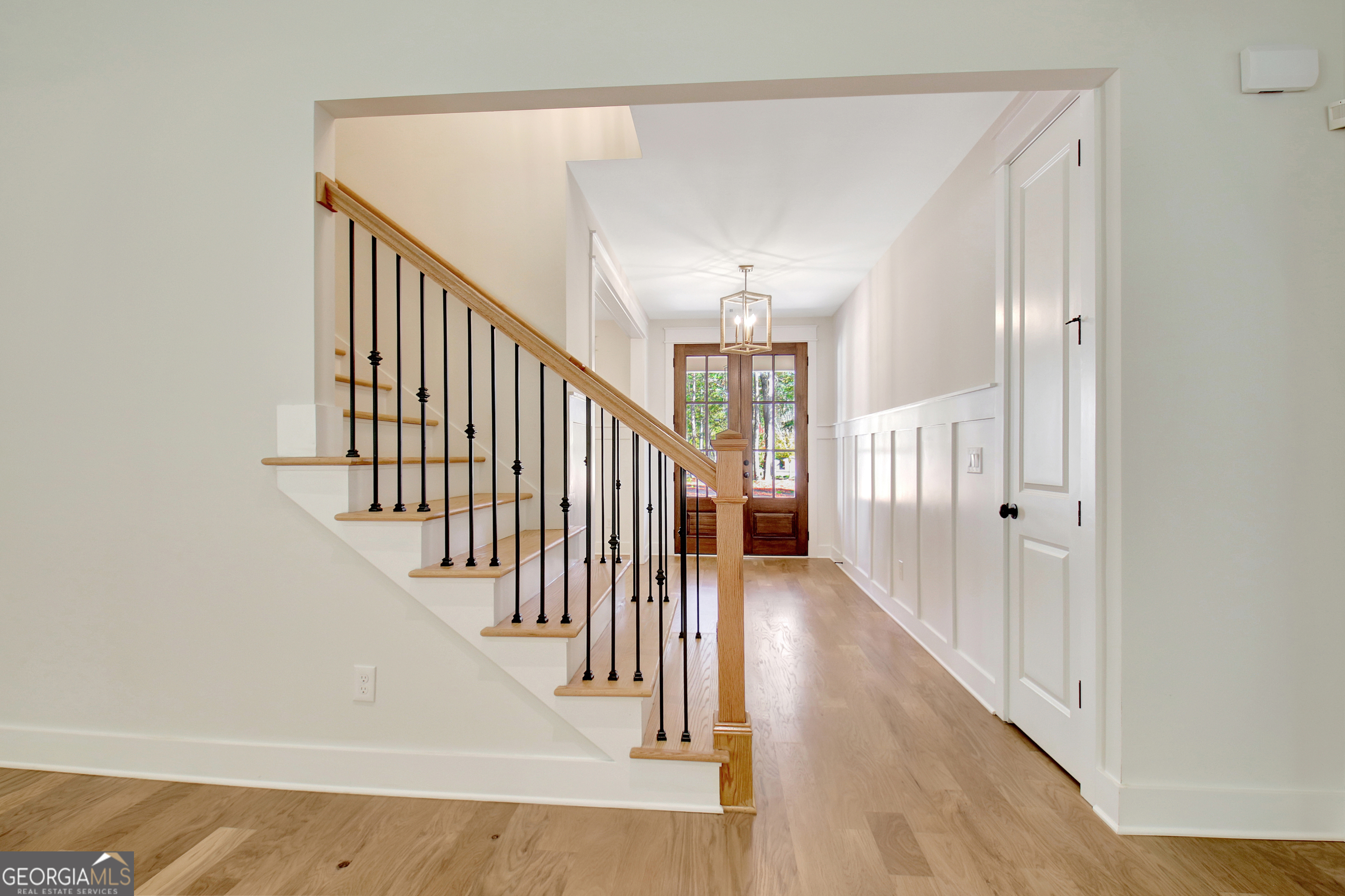 196 Bob Smith Road Sharpsburg, GA 30277 - Photo 11 of 68 a view of a hallway with wooden floor and staircase