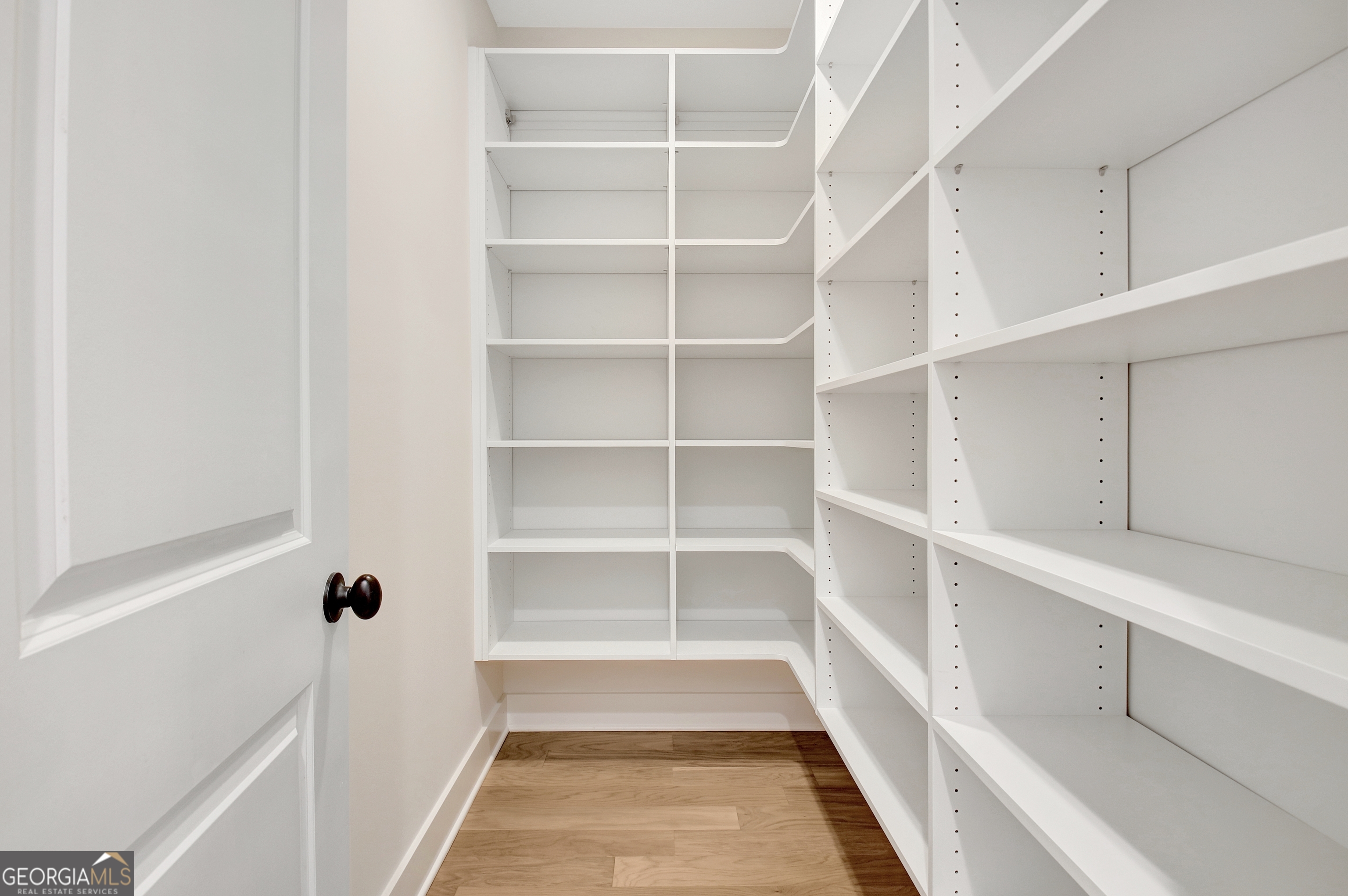 196 Bob Smith Road Sharpsburg, GA 30277 - Photo 30 of 68 a view of a room with shelves on the wall