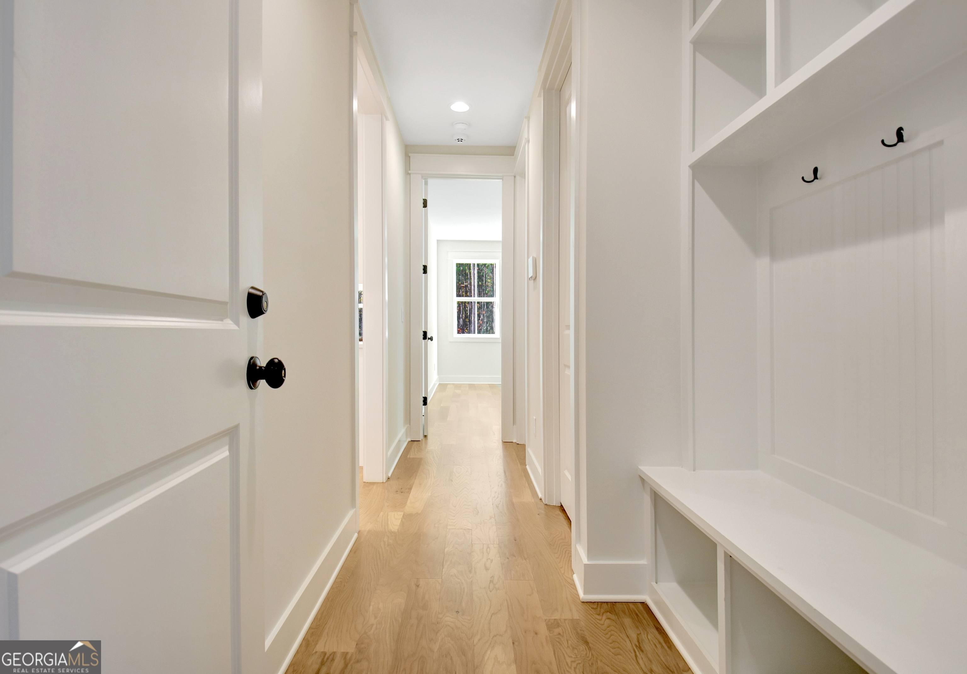 196 Bob Smith Road Sharpsburg, GA 30277 - Photo 31 of 68 a view of a hallway with wooden floor and staircase