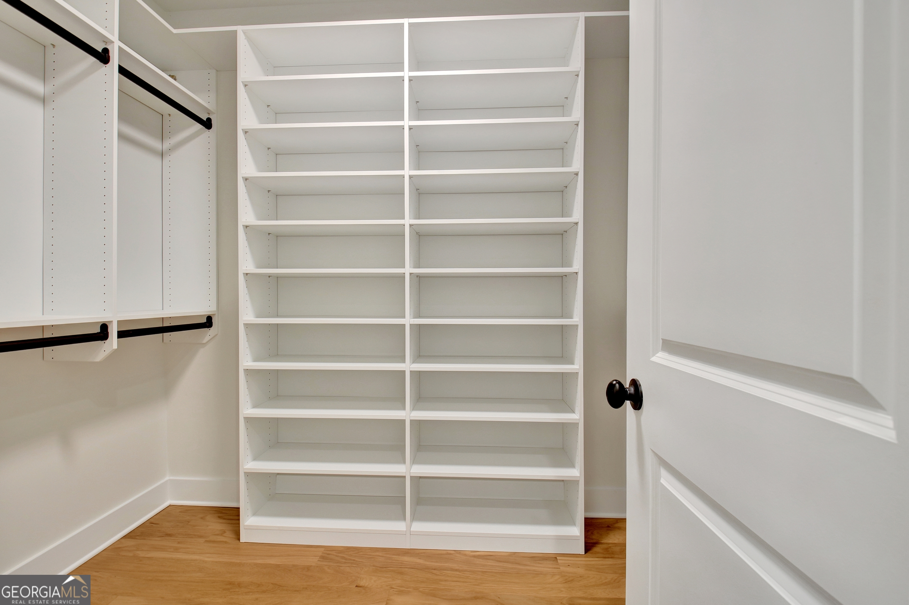 196 Bob Smith Road Sharpsburg, GA 30277 - Photo 42 of 68 a view of walk in closet with empty racks