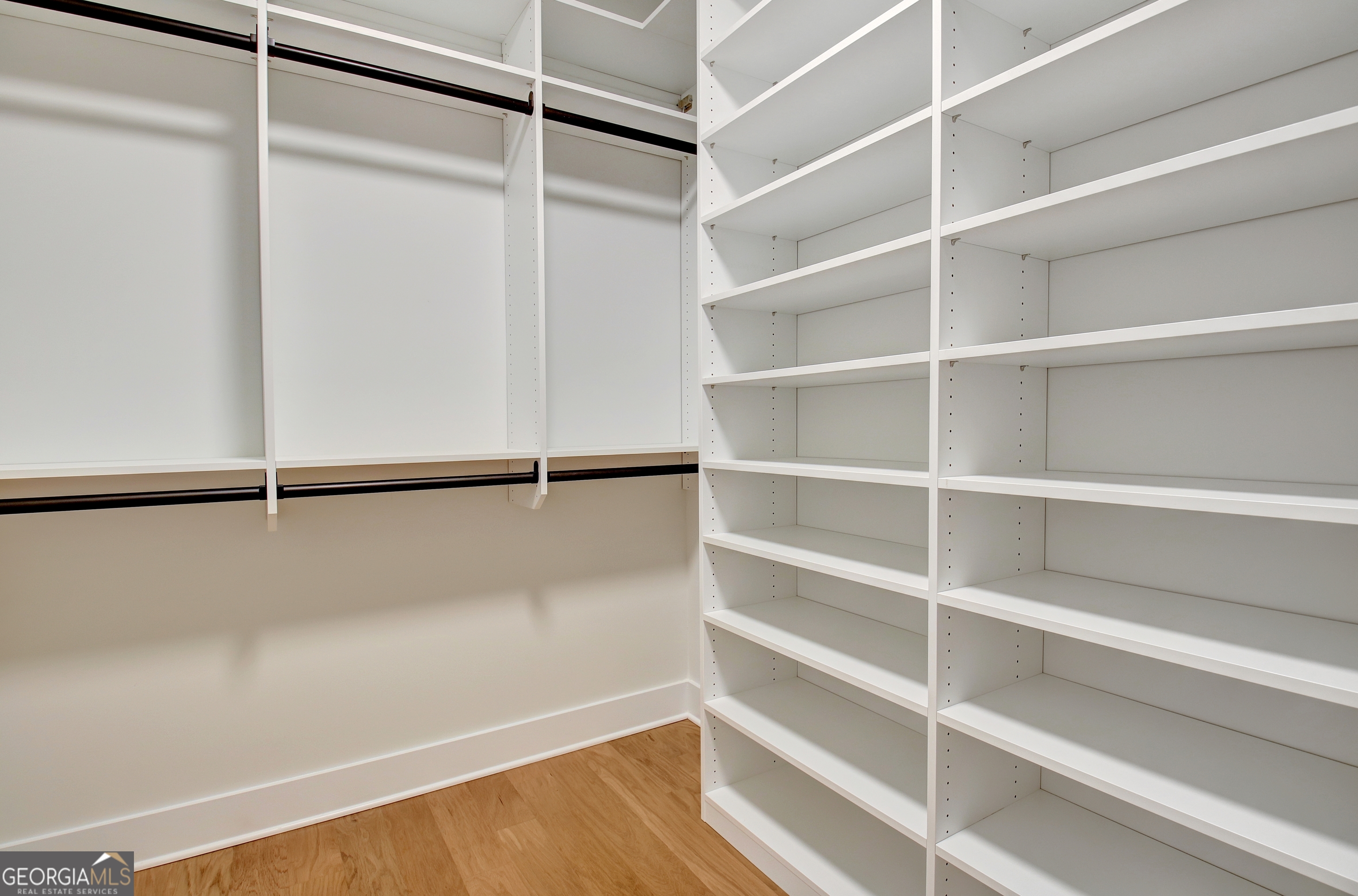 196 Bob Smith Road Sharpsburg, GA 30277 - Photo 44 of 68 a view of walk in closet with empty racks
