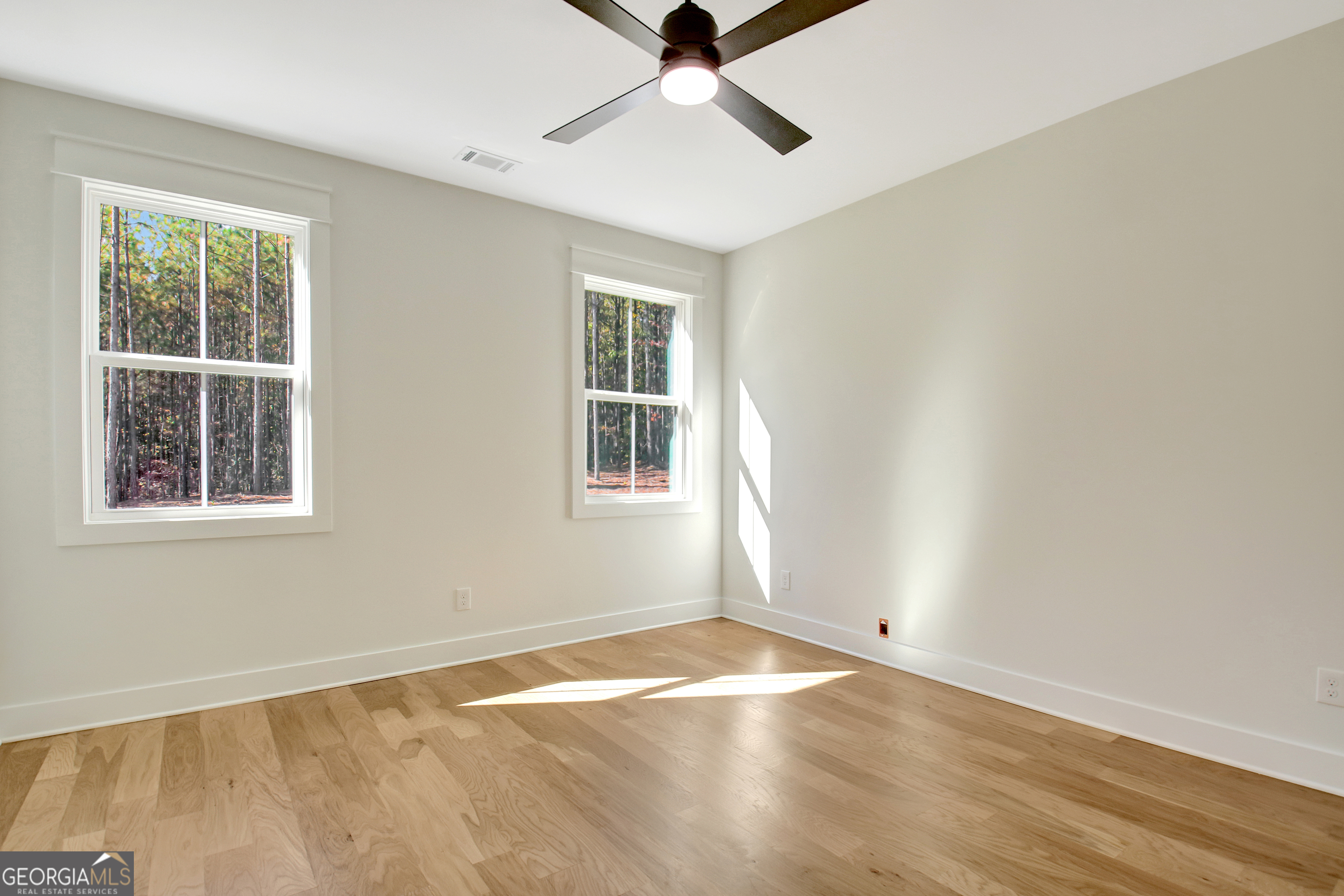 196 Bob Smith Road Sharpsburg, GA 30277 - Photo 45 of 68 wooden floor in an empty room with a window