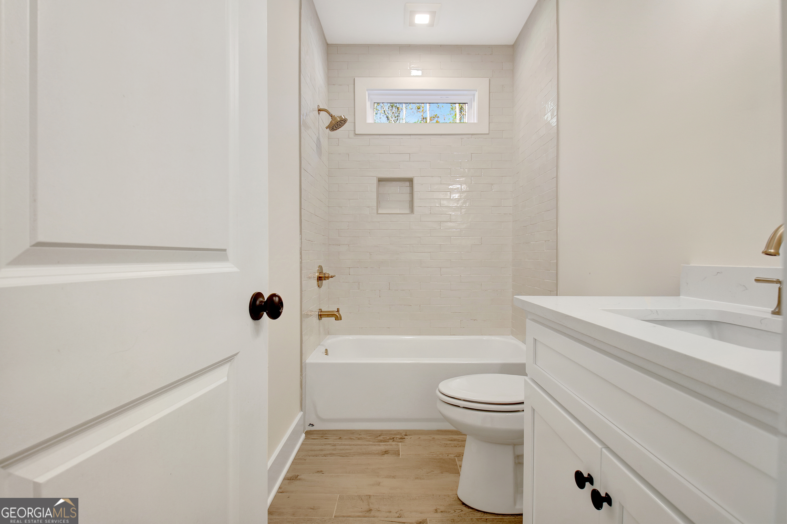 196 Bob Smith Road Sharpsburg, GA 30277 - Photo 47 of 68 a bathroom with a sink a toilet and a bathtub
