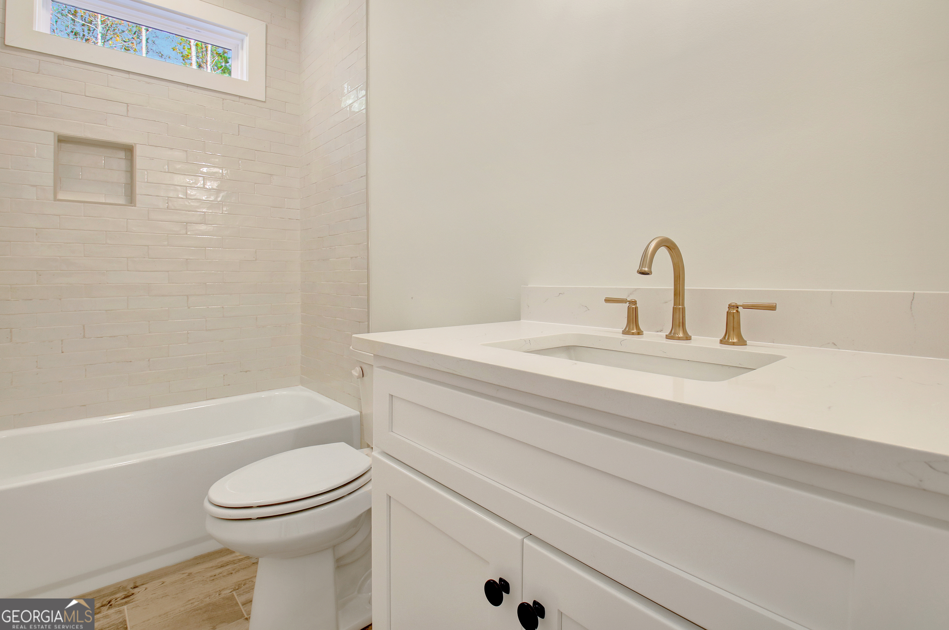 196 Bob Smith Road Sharpsburg, GA 30277 - Photo 48 of 68 a bathroom with a sink a toilet and a bathtub