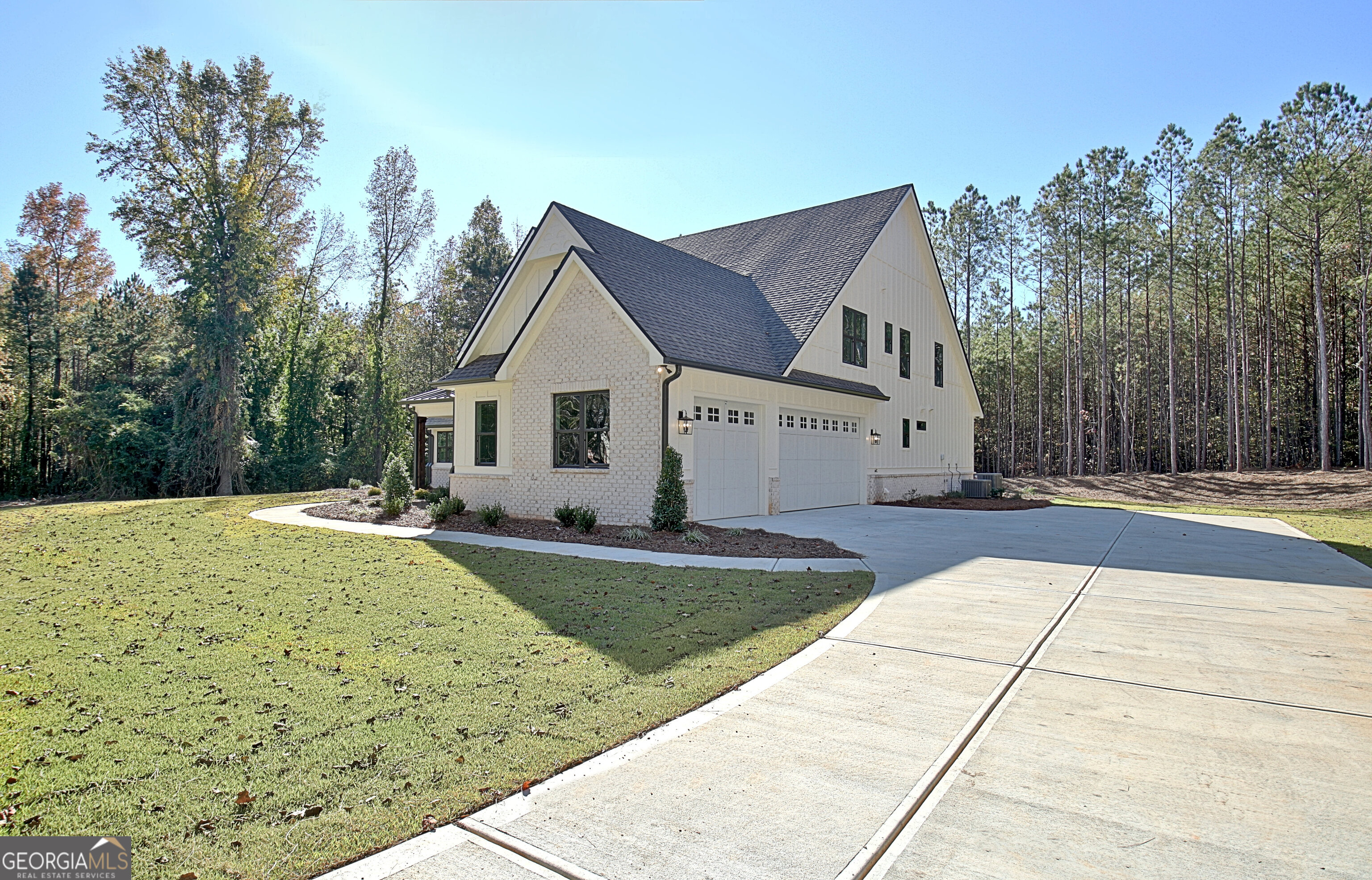 196 Bob Smith Road Sharpsburg, GA 30277 - Photo 5 of 68 a front view of a house with yard
