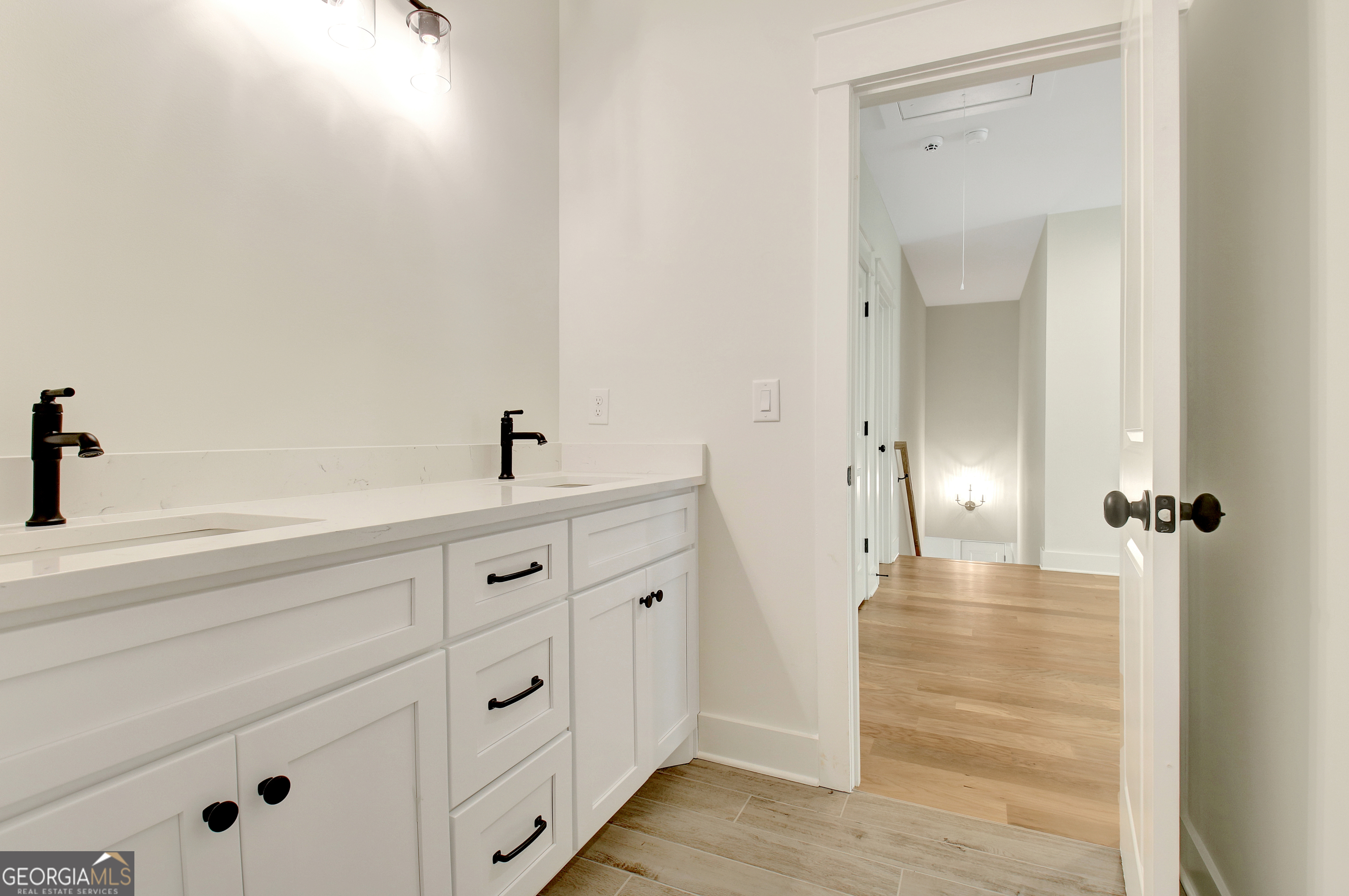 196 Bob Smith Road Sharpsburg, GA 30277 - Photo 54 of 68 a bathroom with a sink and mirror