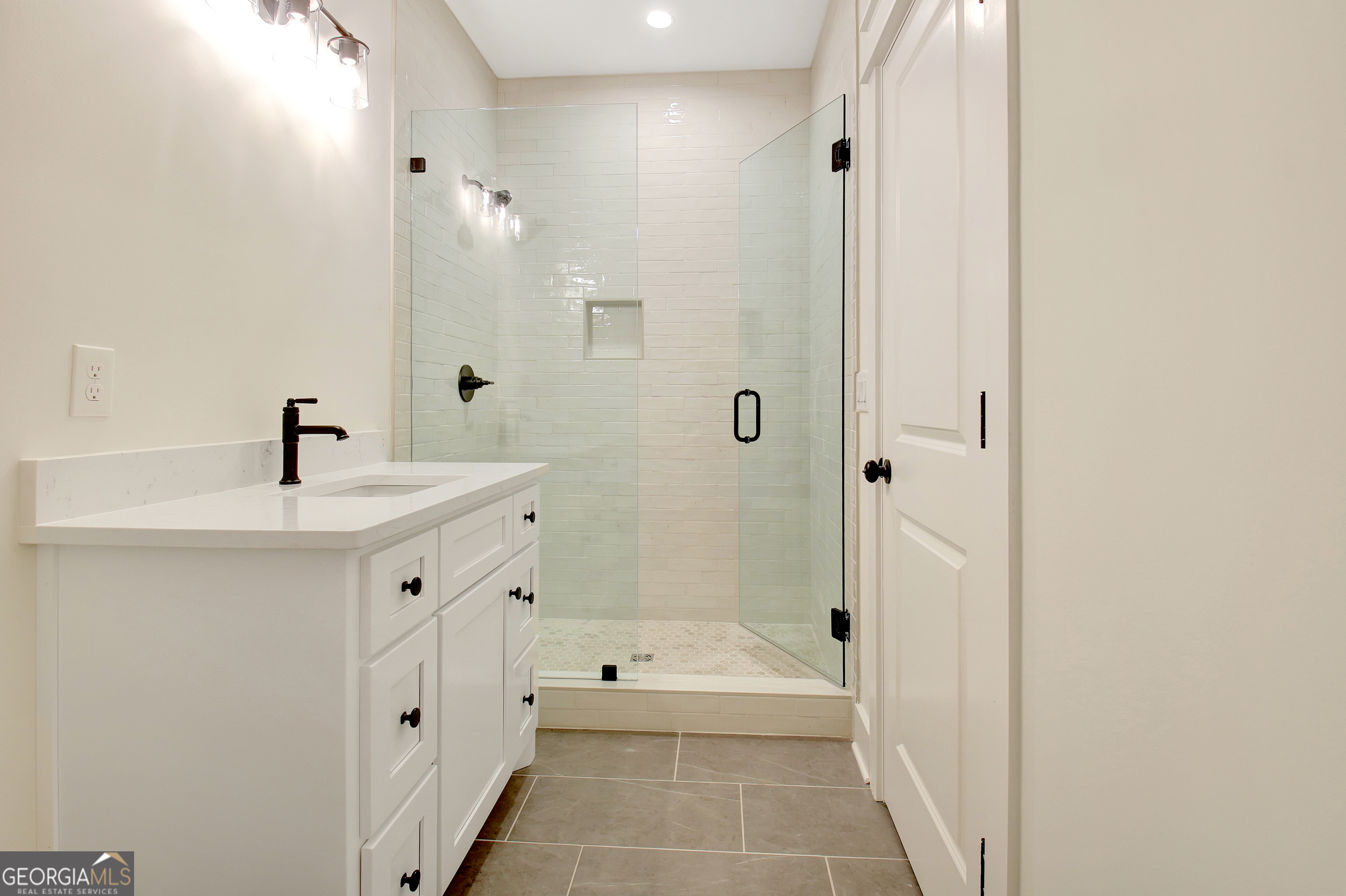 196 Bob Smith Road Sharpsburg, GA 30277 - Photo 60 of 68 a bathroom with a tub sink shower and a mirror