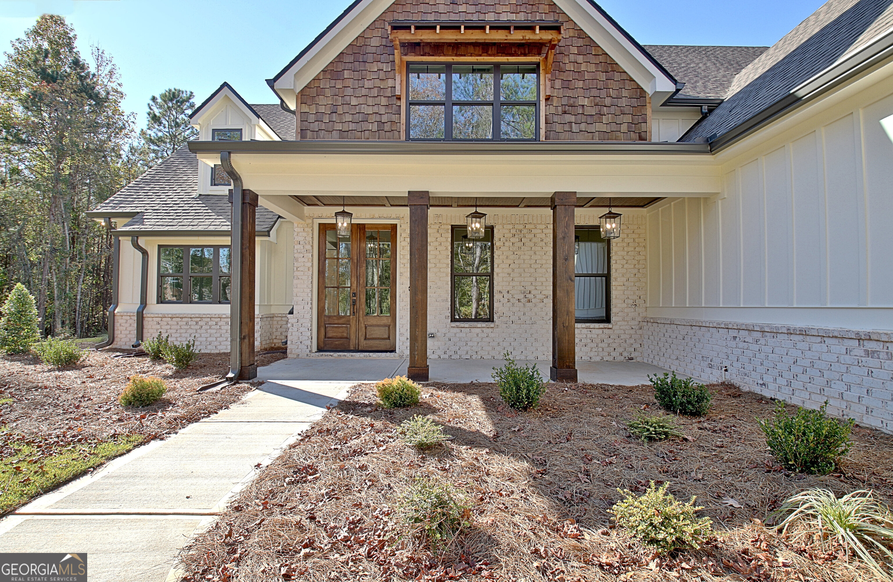 196 Bob Smith Road Sharpsburg, GA 30277 - Photo 6 of 68 a front view of a house with garden