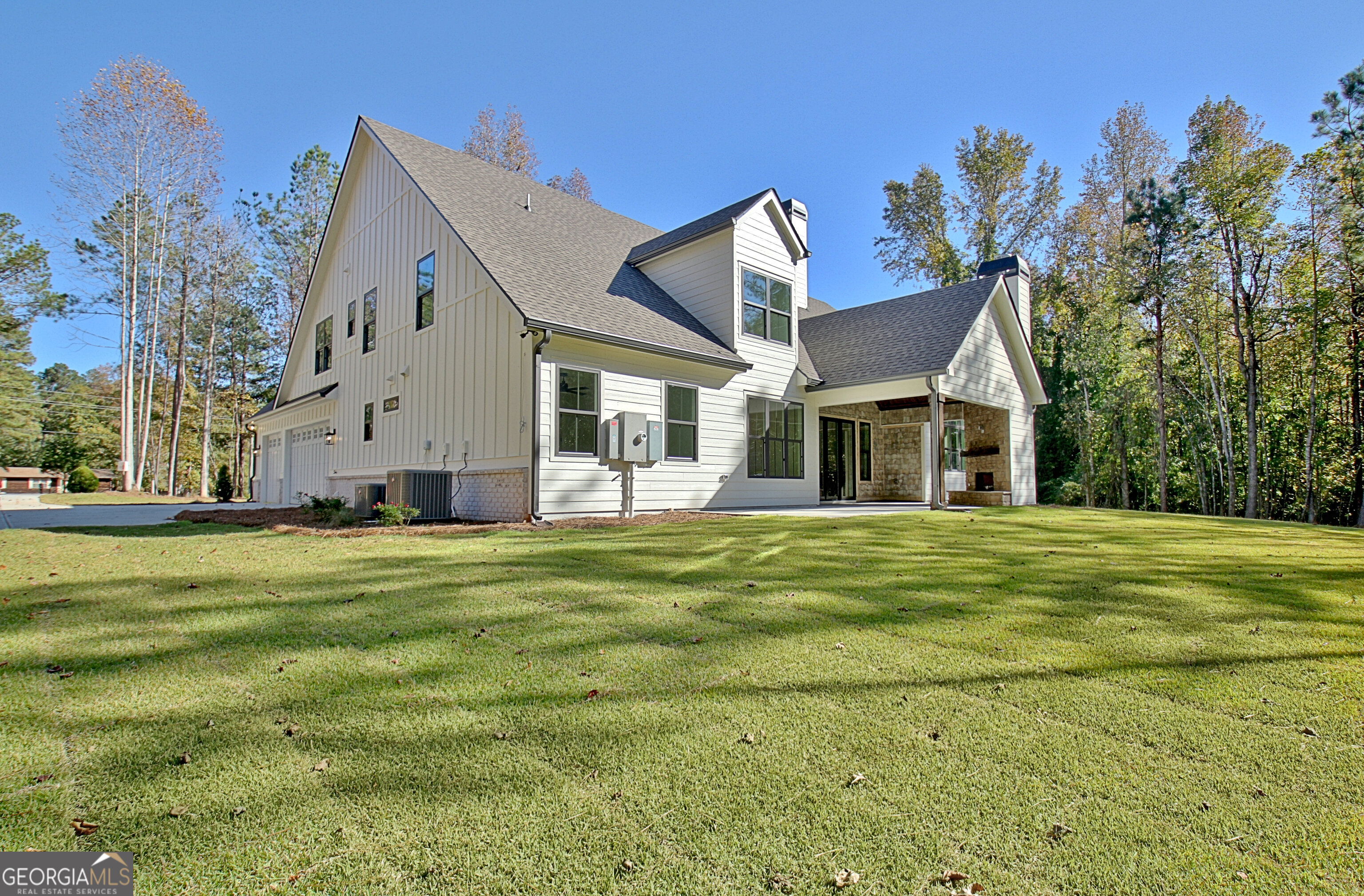 196 Bob Smith Road Sharpsburg, GA 30277 - Photo 63 of 68 a front view of house with yard outdoor seating and green space