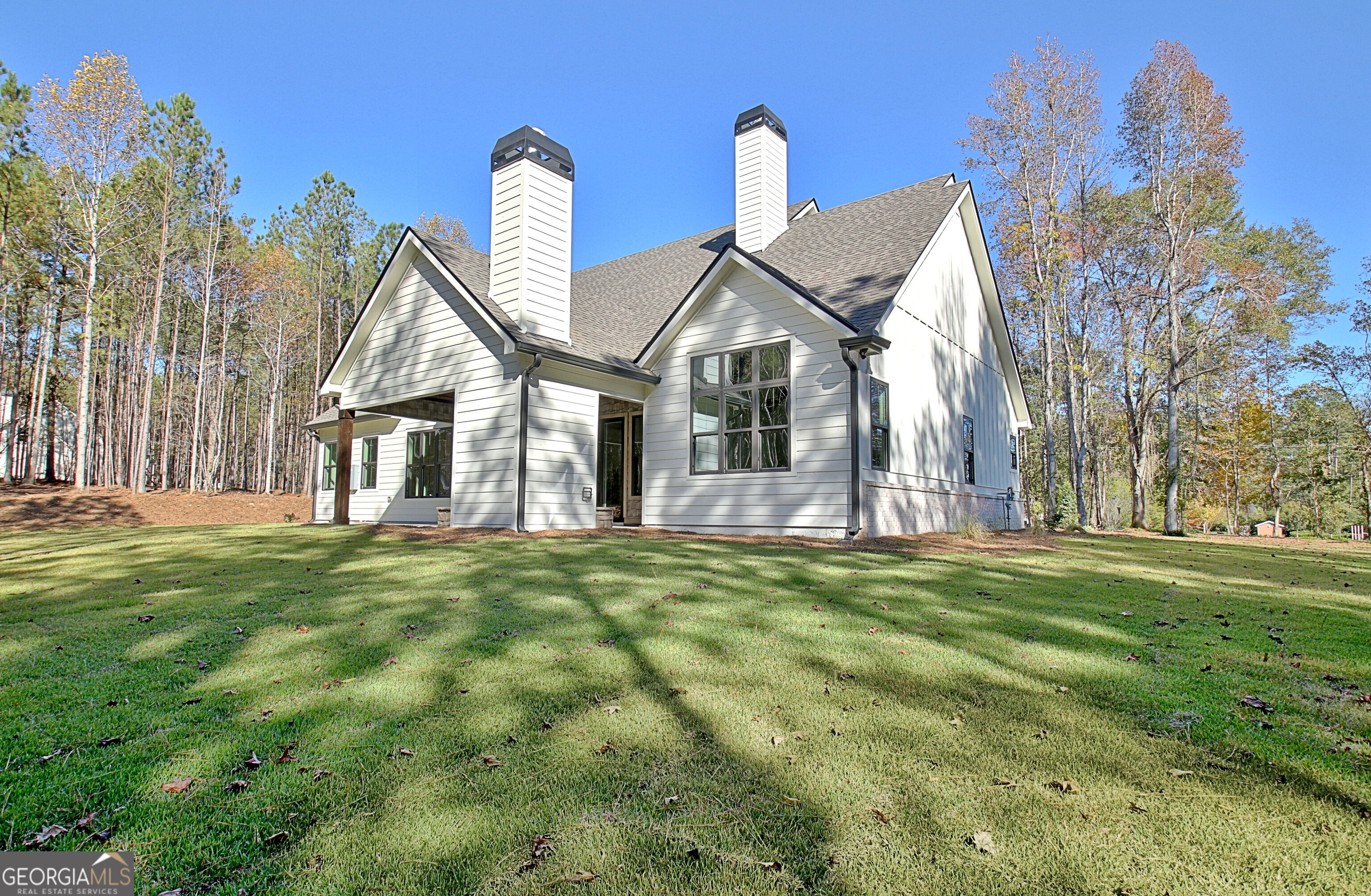 196 Bob Smith Road Sharpsburg, GA 30277 - Photo 64 of 68 a front view of a house with a garden