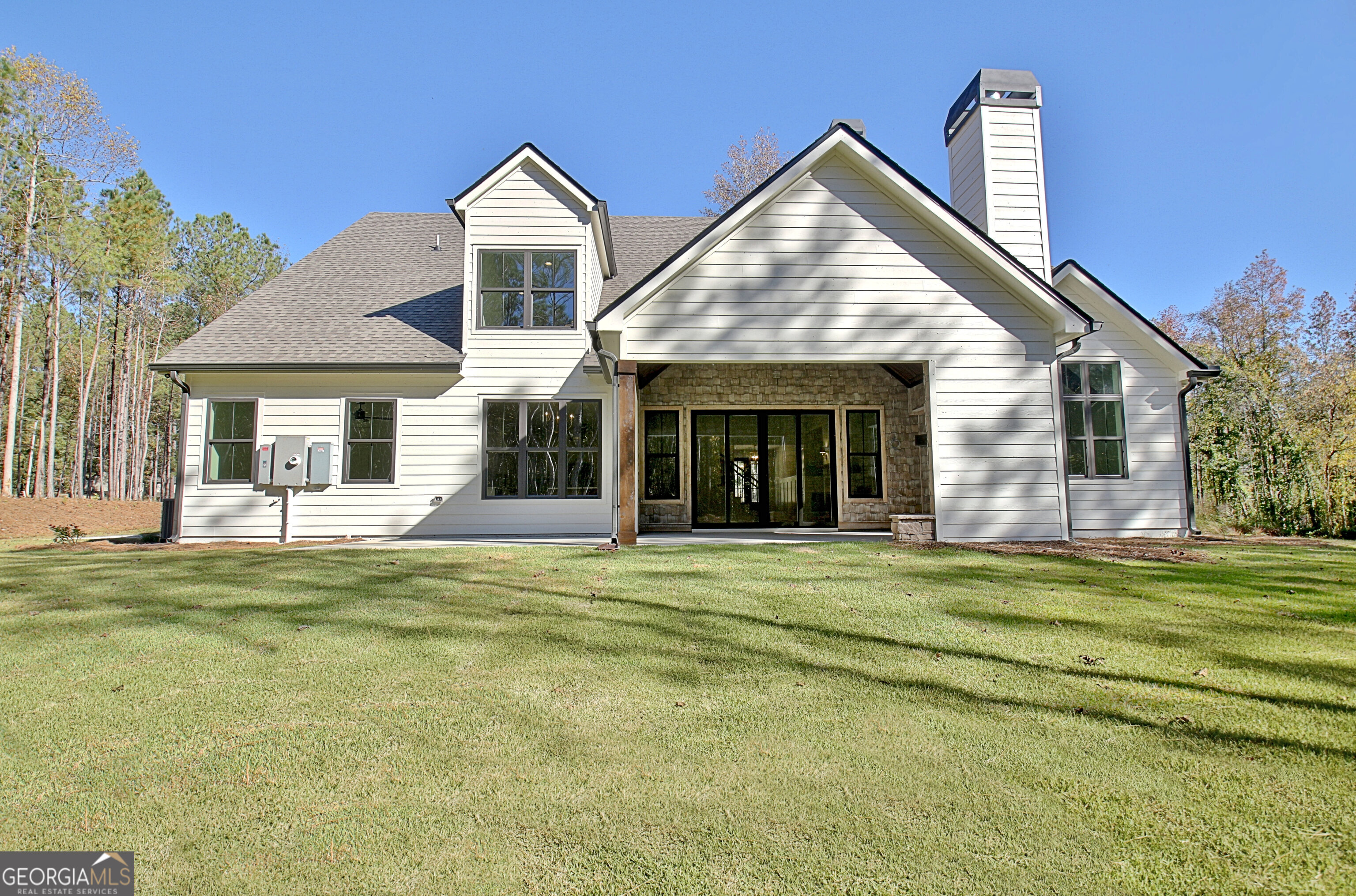196 Bob Smith Road Sharpsburg, GA 30277 - Photo 65 of 68 a front view of a house with a garden