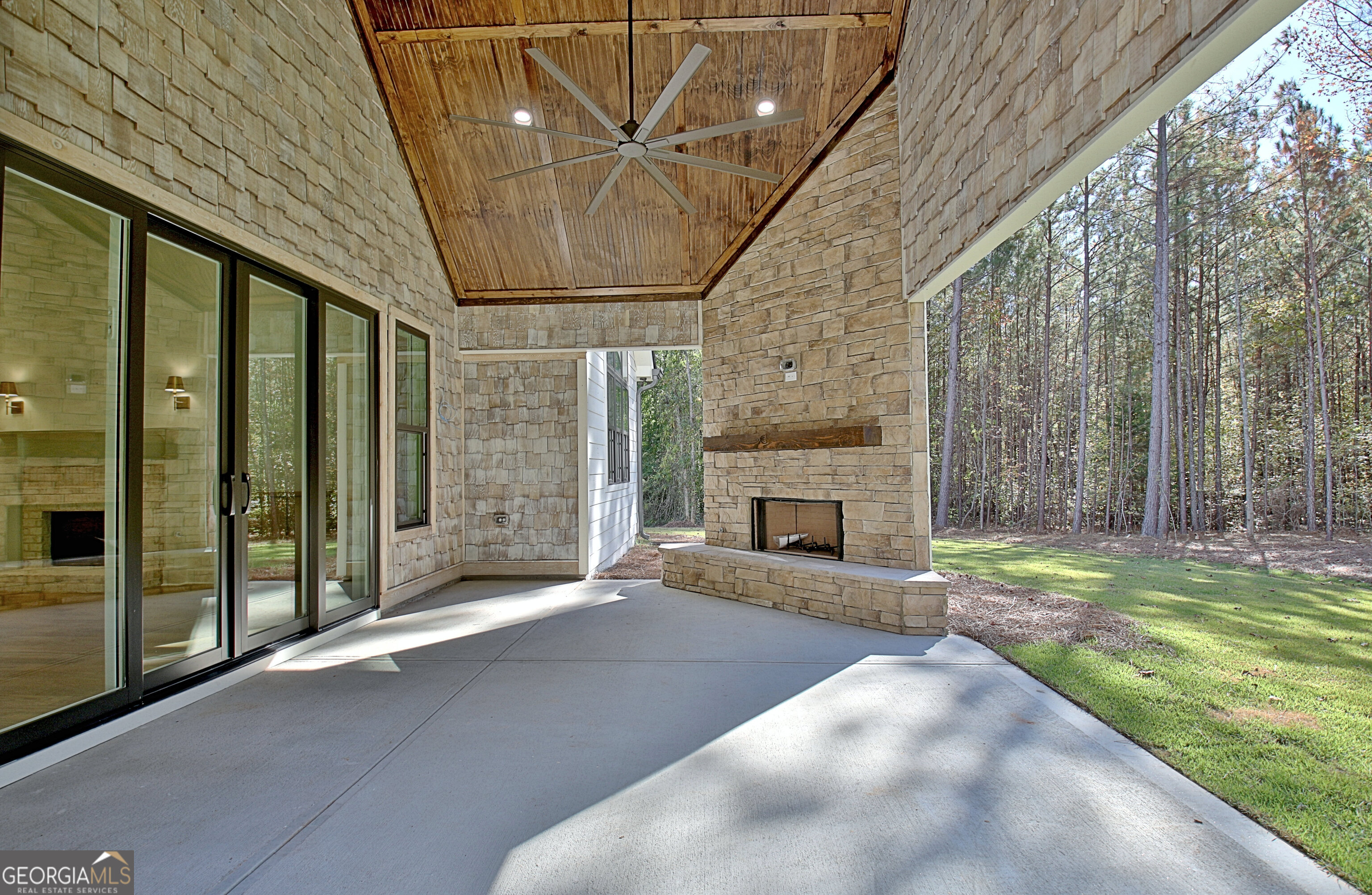 196 Bob Smith Road Sharpsburg, GA 30277 - Photo 68 of 68 a view of a porch with a fireplace