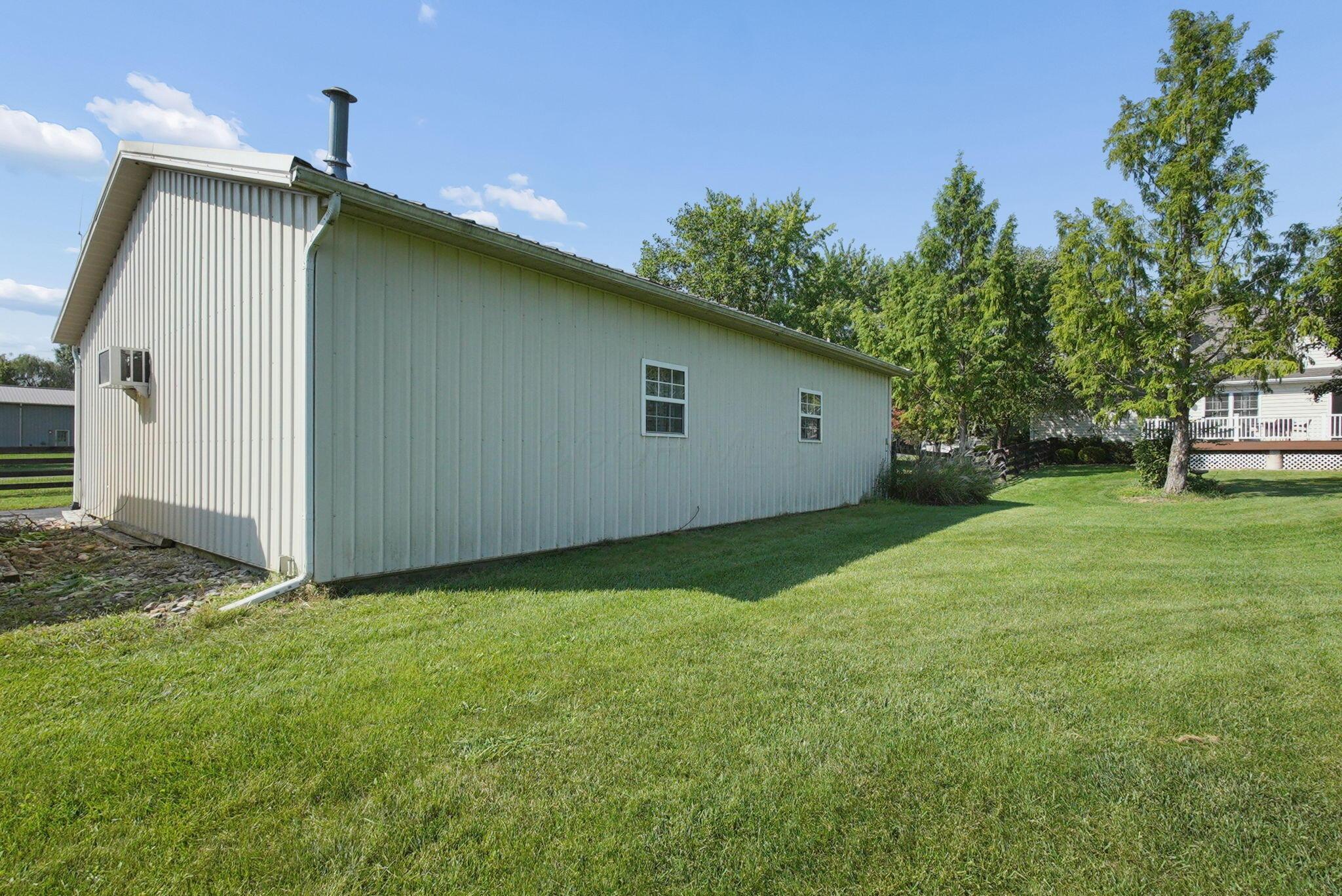9435 Concord Road Powell, OH 43065 - Photo 54 of 77 Metal-sided outbuilding with multiple windows