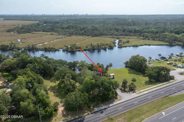 an aerial view of a houses with lake view