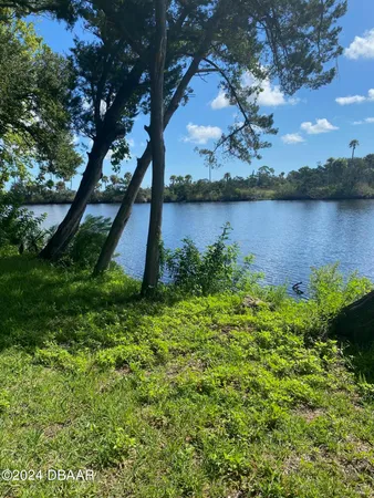 a view of a lake from a yard