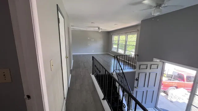 a view of entryway with wooden floor