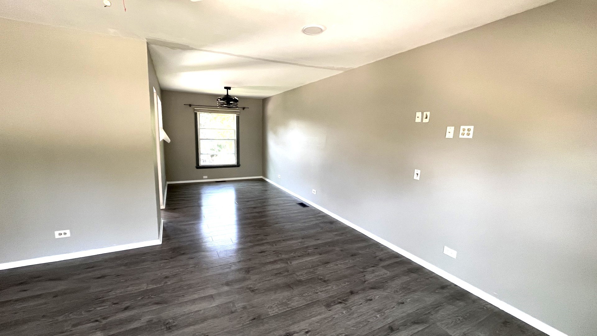110 Woodcrest Circle Streamwood, IL 60107 - Photo 16 of 24 wooden floor in an empty room with a window