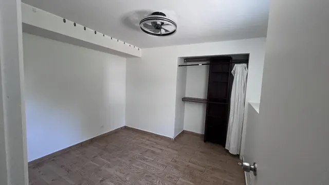 a view of a hallway with closet