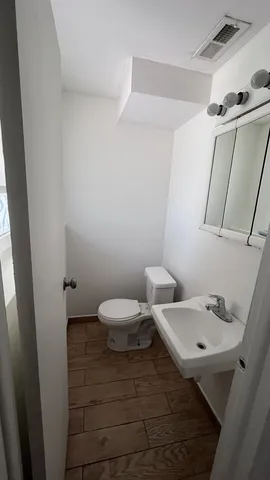 a bathroom with a sink and a toilet