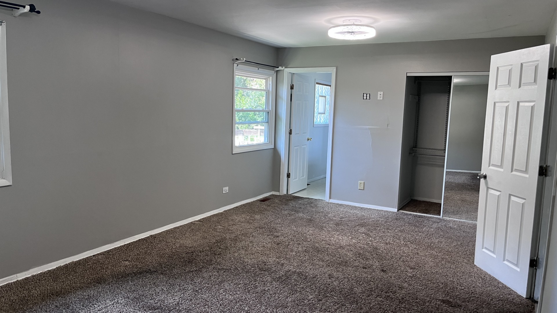 110 Woodcrest Circle Streamwood, IL 60107 - Photo 5 of 24 an empty room with windows and closet