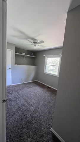 a view of empty room with windows