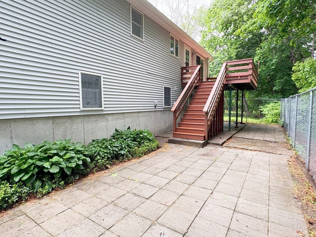 2 Robert Cohen Drive Canton, MA 02021 - Photo 24 of 26 a backyard of a house with lots of green space