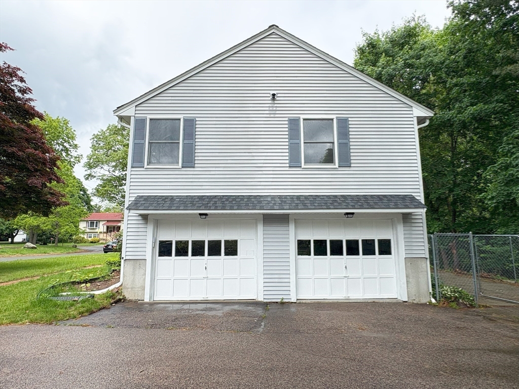 2 Robert Cohen Drive Canton, MA 02021 - Photo 25 of 26 a view of a white house next to yard and large trees