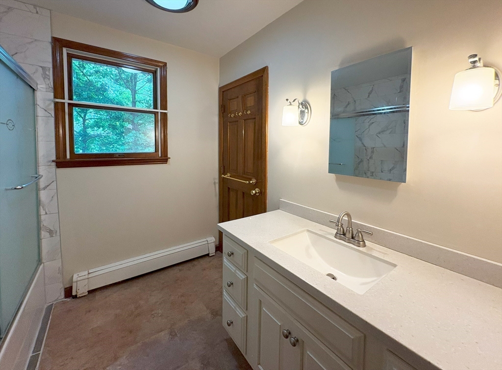 2 Robert Cohen Drive Canton, MA 02021 - Photo 9 of 26 a bathroom with a sink and a mirror