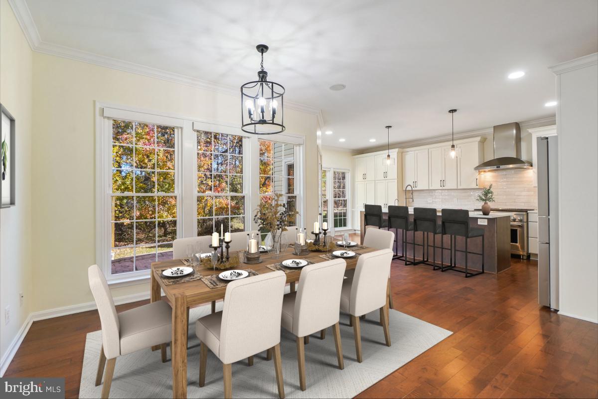 2442 Arctic Fox Way Reston, VA 20191 - Photo 12 of 58 a view of a dining room with furniture window and wooden floor