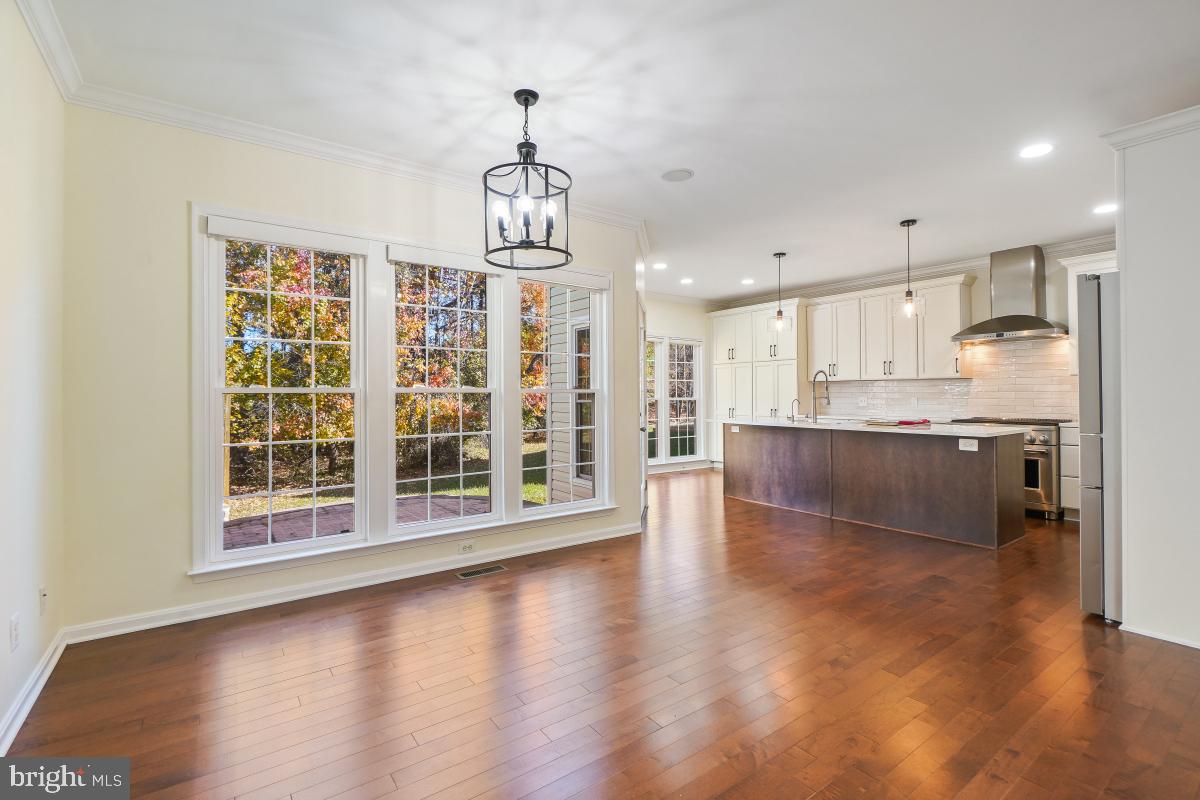 2442 Arctic Fox Way Reston, VA 20191 - Photo 13 of 58 a view of a kitchen with a sink cabinets and wooden floor