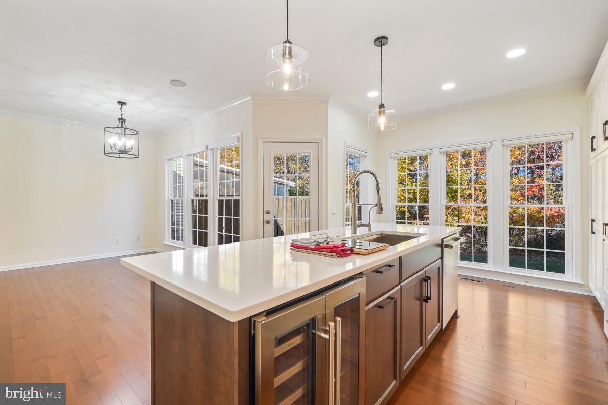 2442 Arctic Fox Way Reston, VA 20191 - Photo 17 of 58 a kitchen that has a lot of cabinets and wooden floor