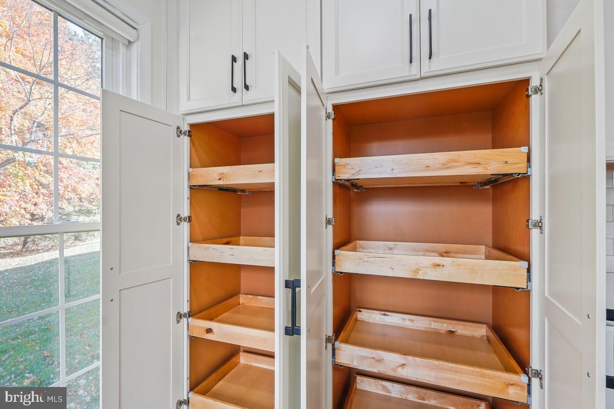 2442 Arctic Fox Way Reston, VA 20191 - Photo 19 of 58 a utility room with wooden floor and window
