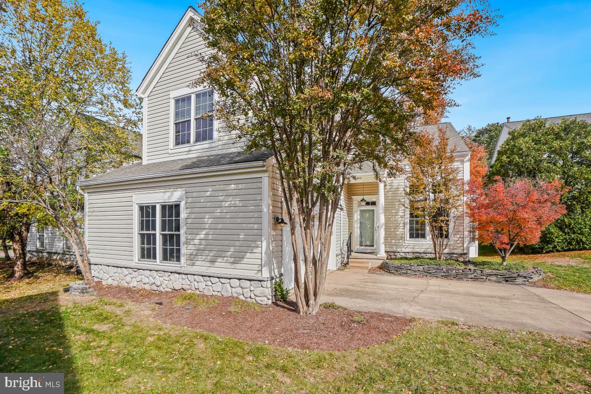 2442 Arctic Fox Way Reston, VA 20191 - Photo 2 of 58 a house that has a tree in front of the house