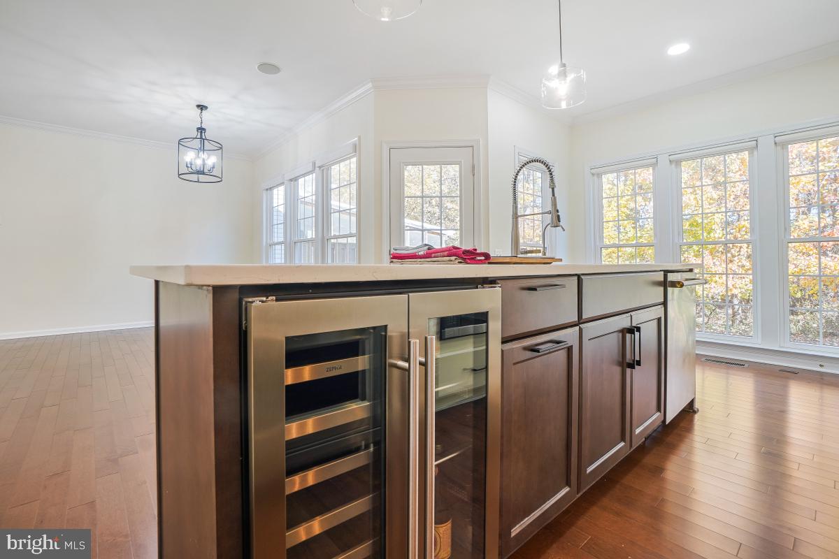 2442 Arctic Fox Way Reston, VA 20191 - Photo 22 of 58 a kitchen with stainless steel appliances granite countertop a stove a sink and a refrigerator