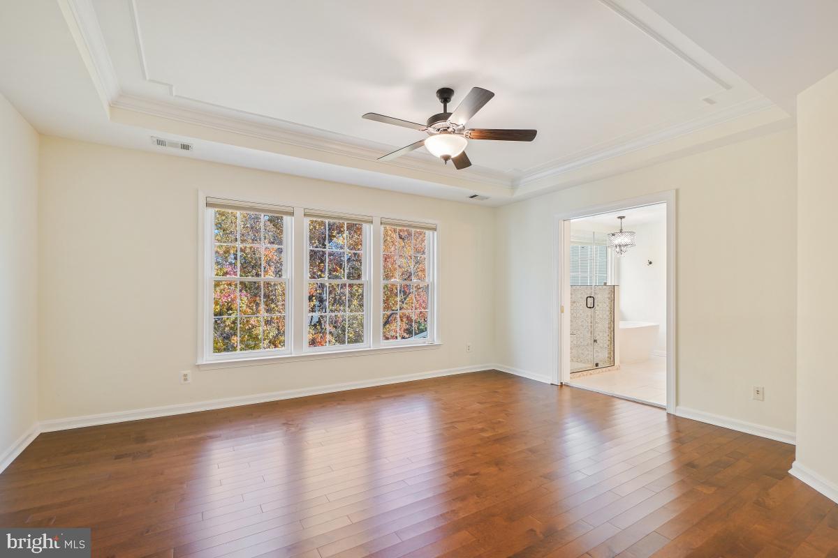 2442 Arctic Fox Way Reston, VA 20191 - Photo 28 of 58 a view of an empty room with a window and wooden floor