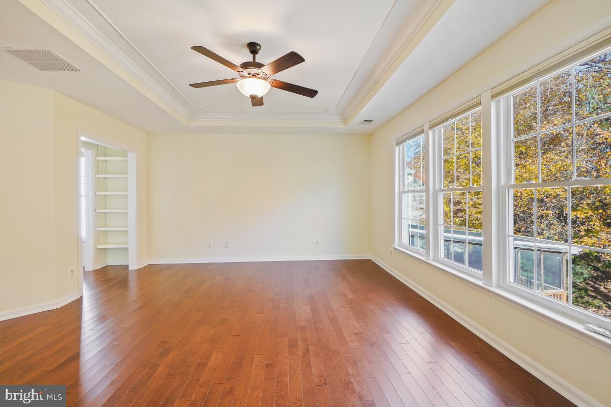 2442 Arctic Fox Way Reston, VA 20191 - Photo 29 of 58 a view of an empty room with wooden floor and a window