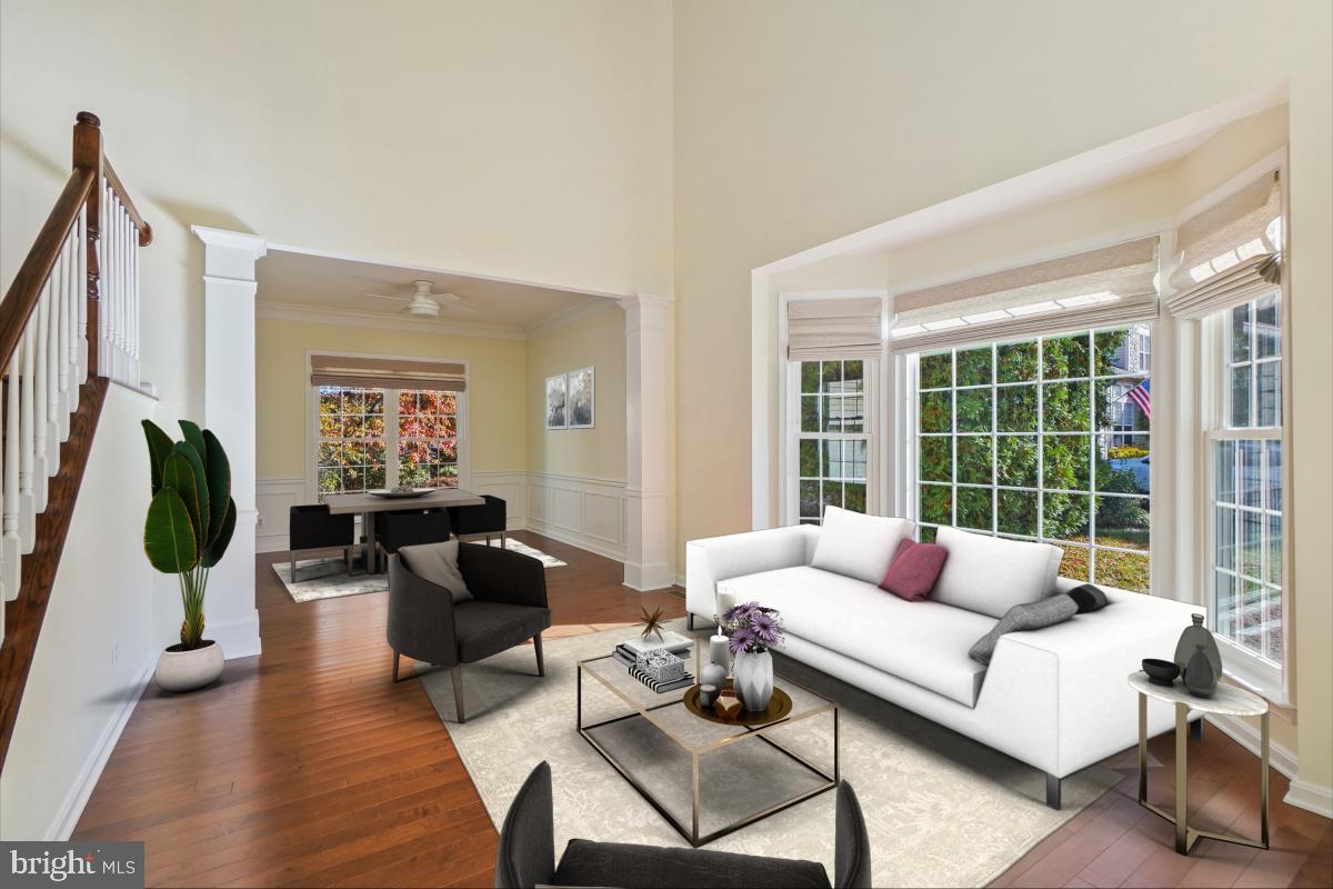 2442 Arctic Fox Way Reston, VA 20191 - Photo 3 of 58 a living room with furniture and a flat screen tv
