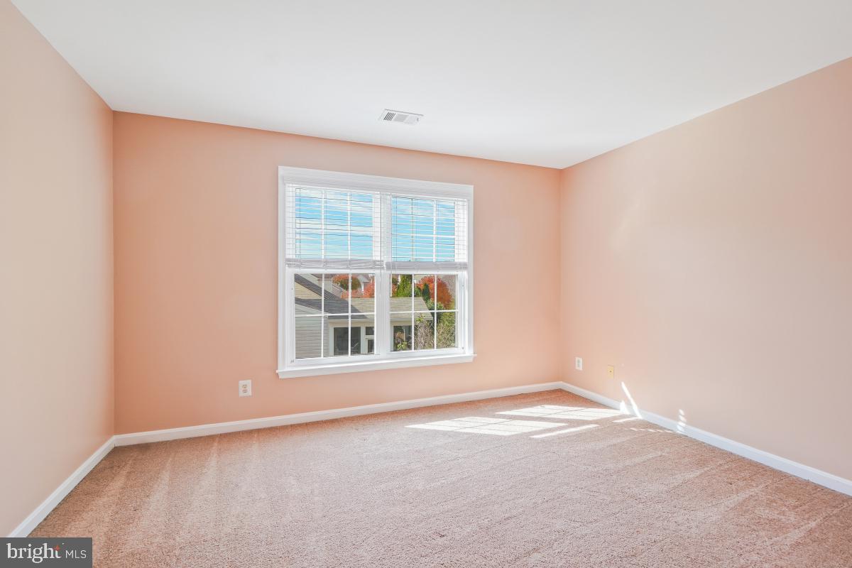 2442 Arctic Fox Way Reston, VA 20191 - Photo 39 of 58 an empty room with a window