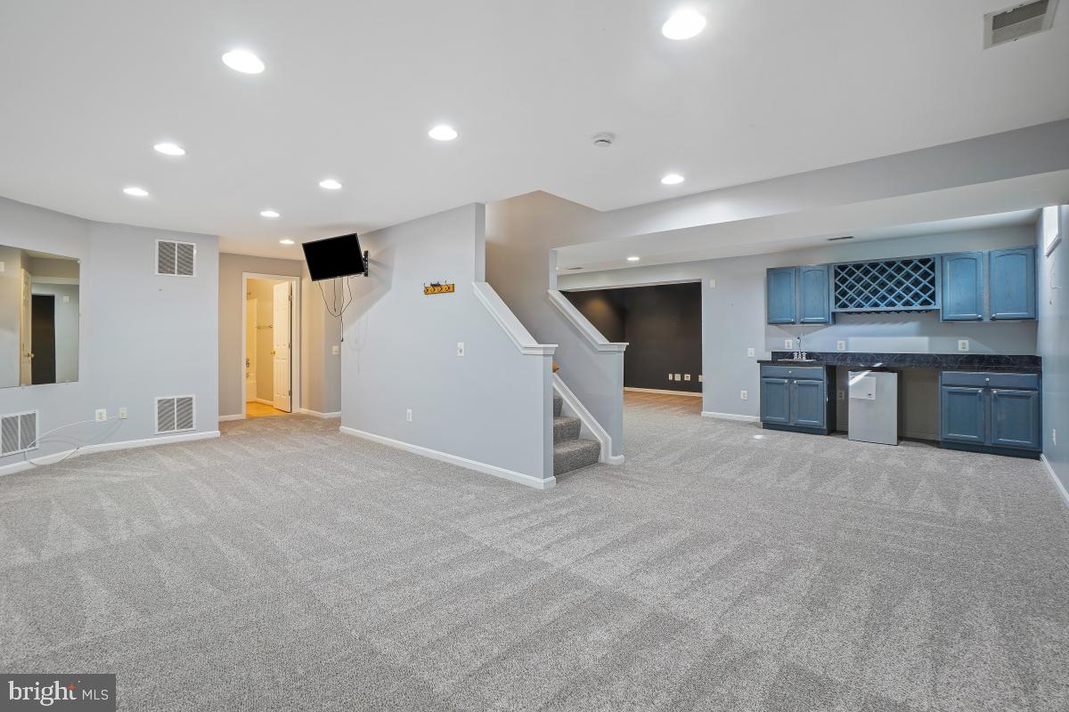 2442 Arctic Fox Way Reston, VA 20191 - Photo 41 of 58 a view of an empty room with a fireplace and a window
