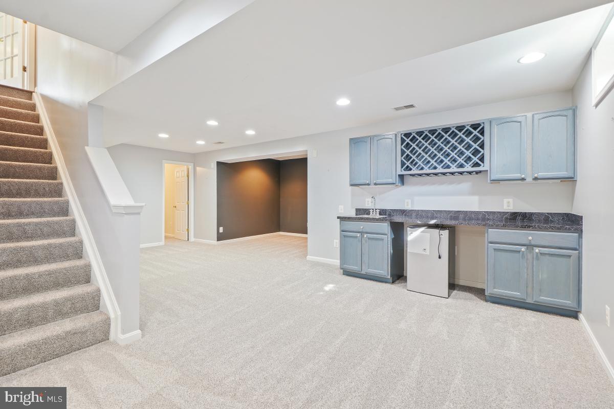 2442 Arctic Fox Way Reston, VA 20191 - Photo 43 of 58 a kitchen with a sink stove and cabinets