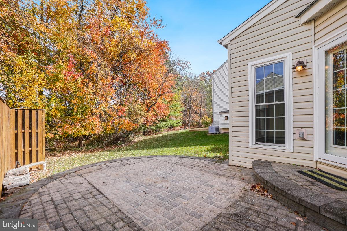 2442 Arctic Fox Way Reston, VA 20191 - Photo 49 of 58 a front view of a house with a yard and trees