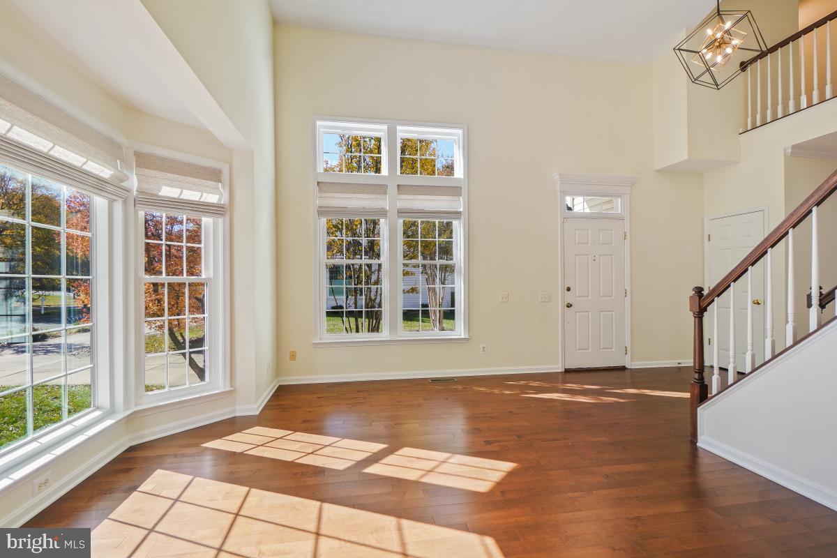 2442 Arctic Fox Way Reston, VA 20191 - Photo 7 of 58 a view of an empty room with windows