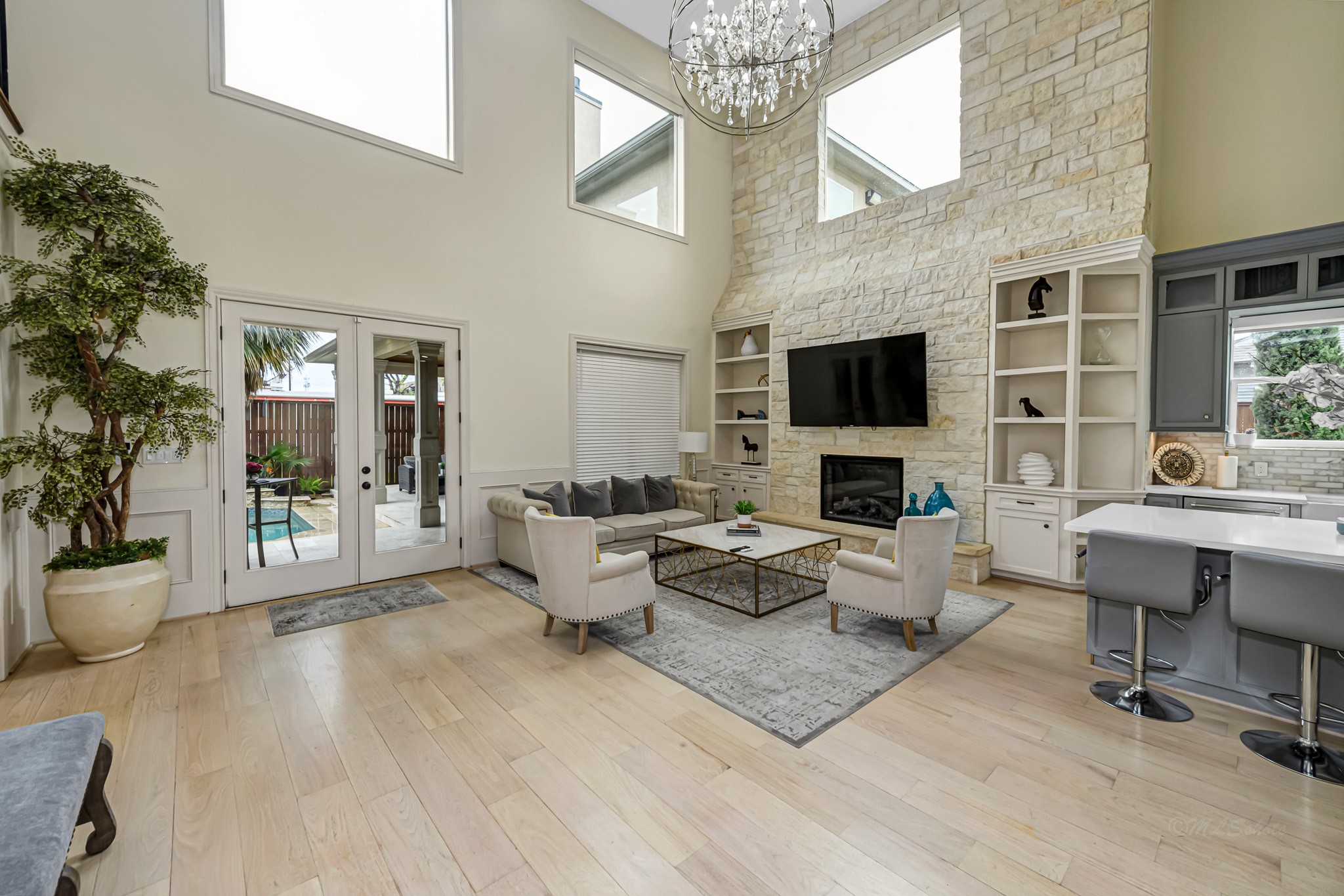 1340 Idylwild Street Houston, TX 77009 - Photo 17 of 42 Elegant stone wall hosts the fireplace and built in display cases for your favorite artwork