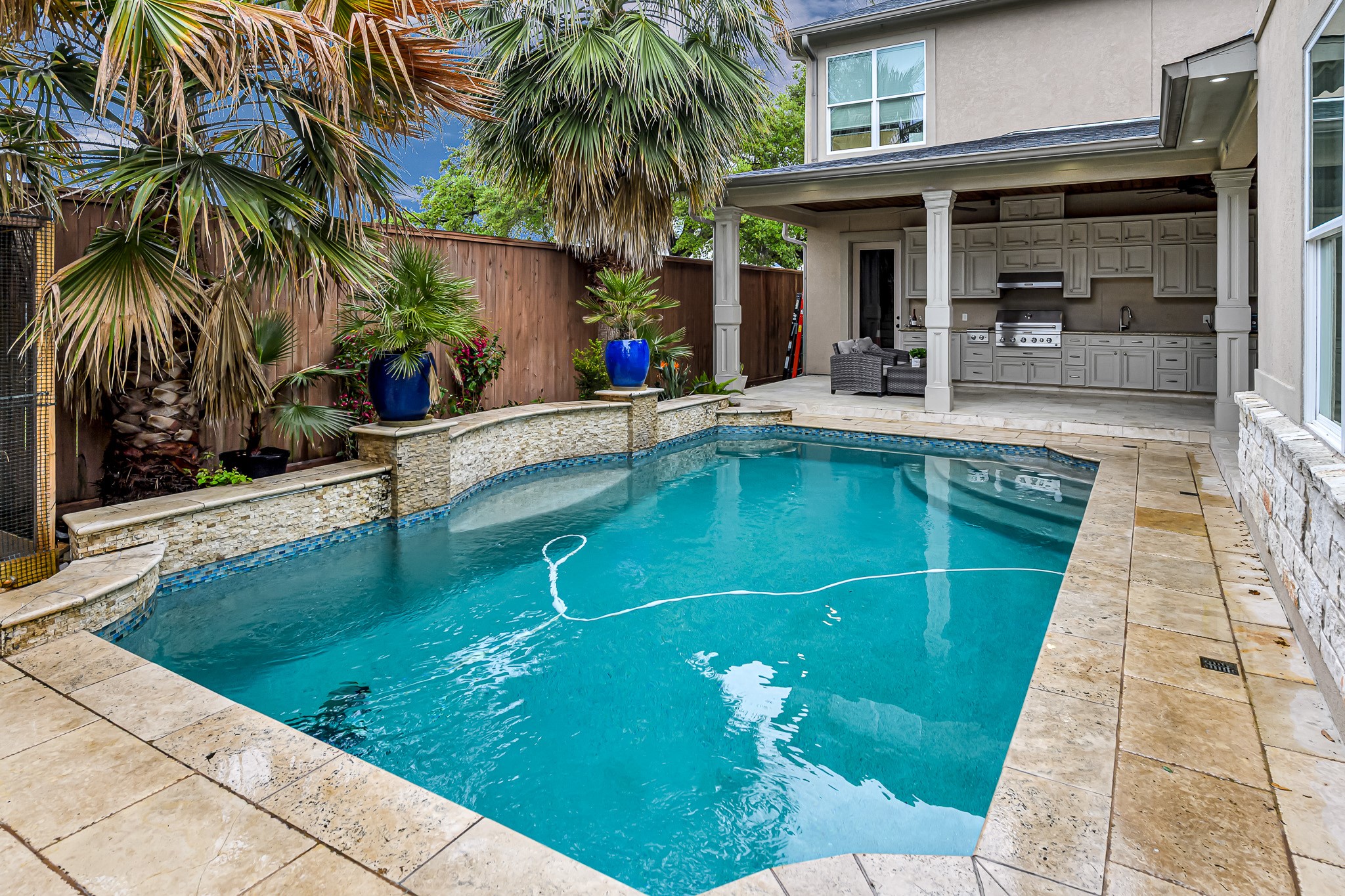 1340 Idylwild Street Houston, TX 77009 - Photo 2 of 42 The centerpiece of the yard is this stunning resort-style pool, its crystal-clear water glistening under the sun