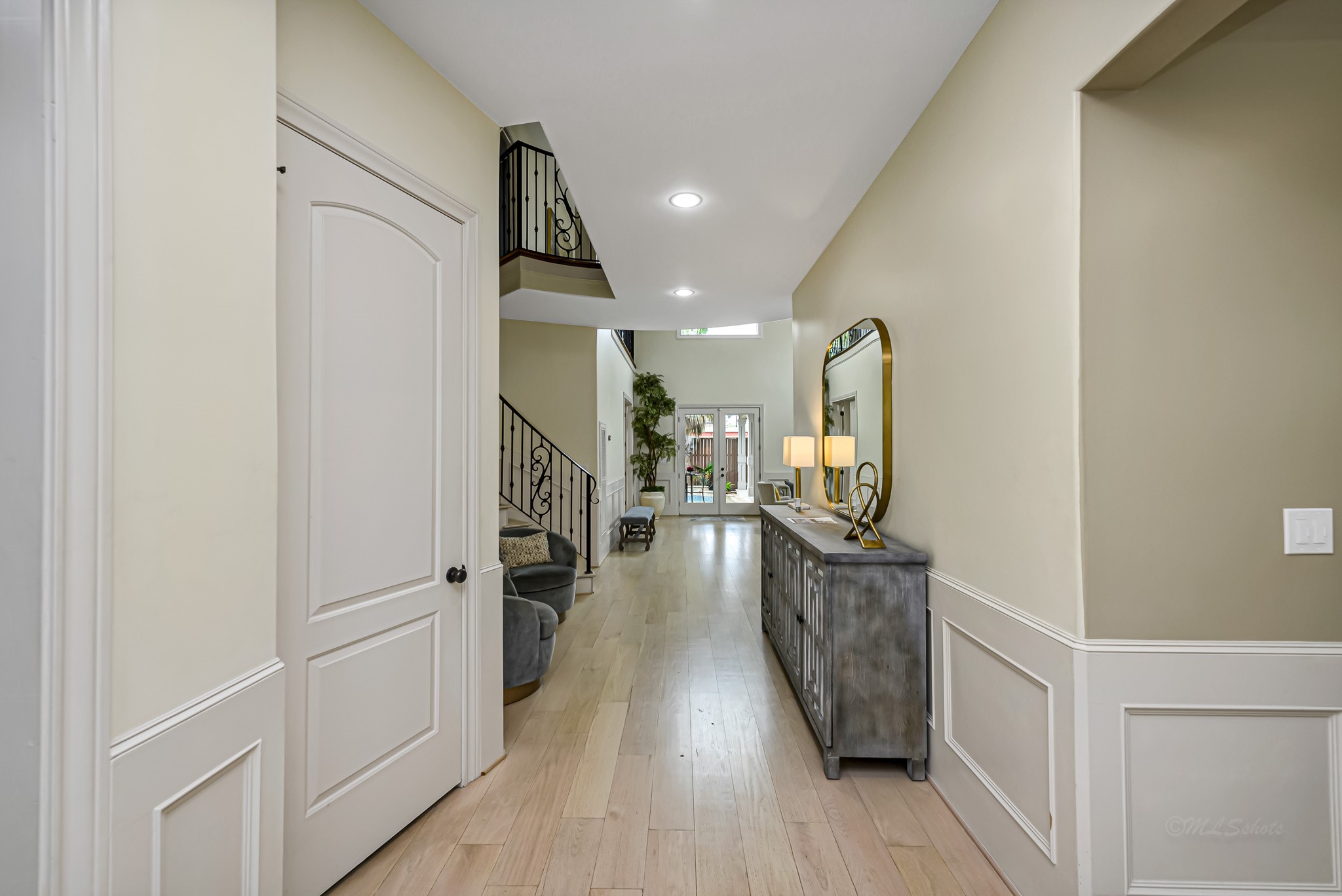 1340 Idylwild Street Houston, TX 77009 - Photo 5 of 42 Immediately as you enter though the large custom double doors you are greeted by the long corridor which aligns perfectly with the glass doors at the rear of the home allowing an unobstructed line of sight to the lush backyard
