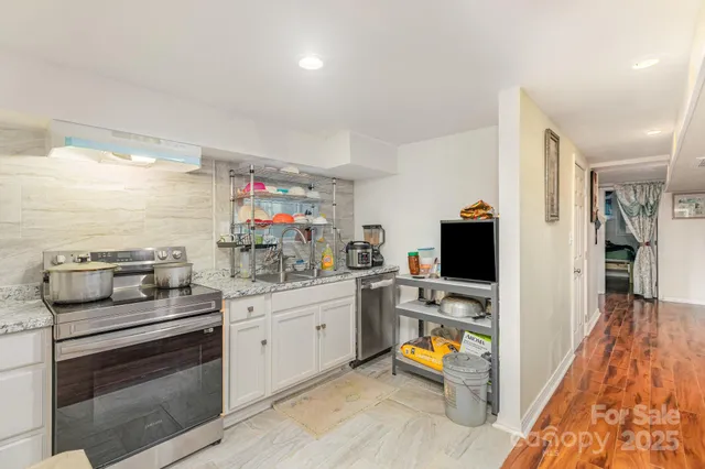 a kitchen with a sink cabinets and appliances