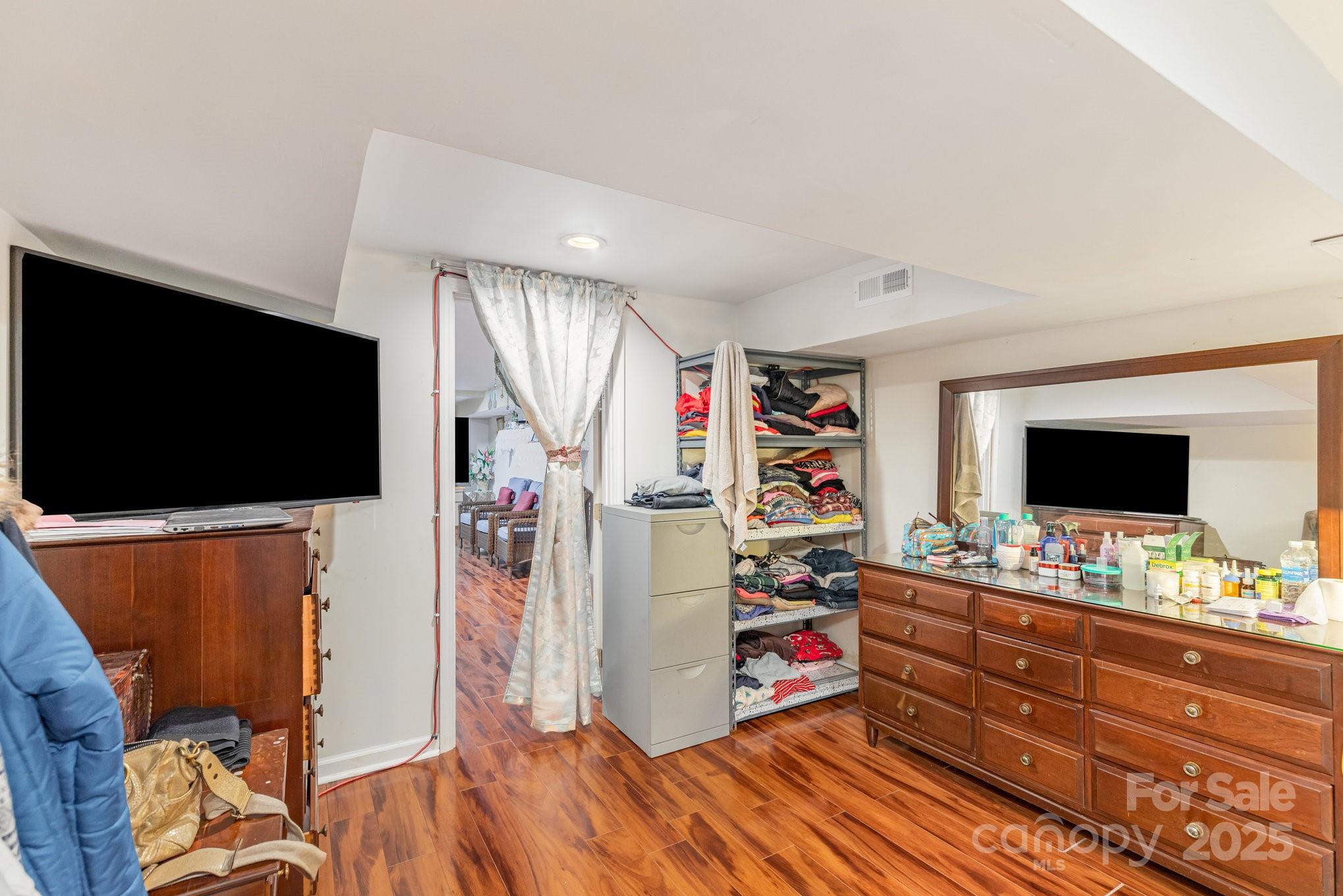 9716 Sunway Drive Mint Hill, NC 28227 - Photo 16 of 31 a room with furniture and a flat screen tv