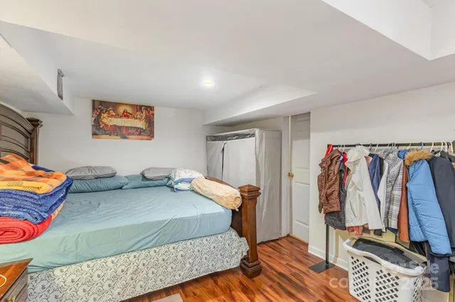 a bedroom with a bed and a walk in closet