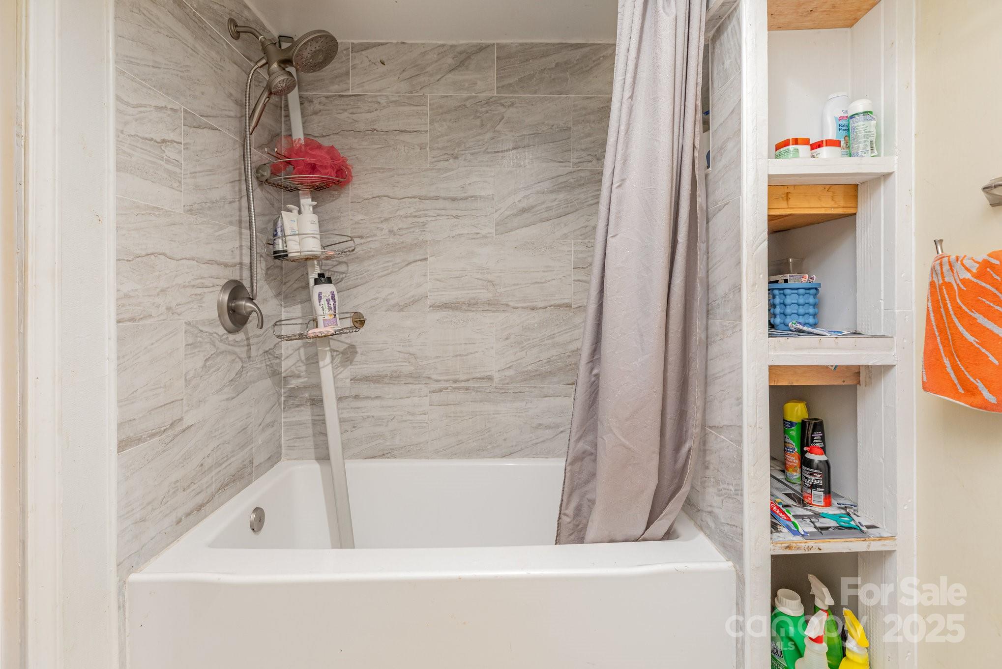 9716 Sunway Drive Mint Hill, NC 28227 - Photo 20 of 31 a bath tub sitting next to a bathroom