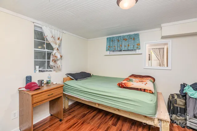 a bedroom with a bed and cabinets